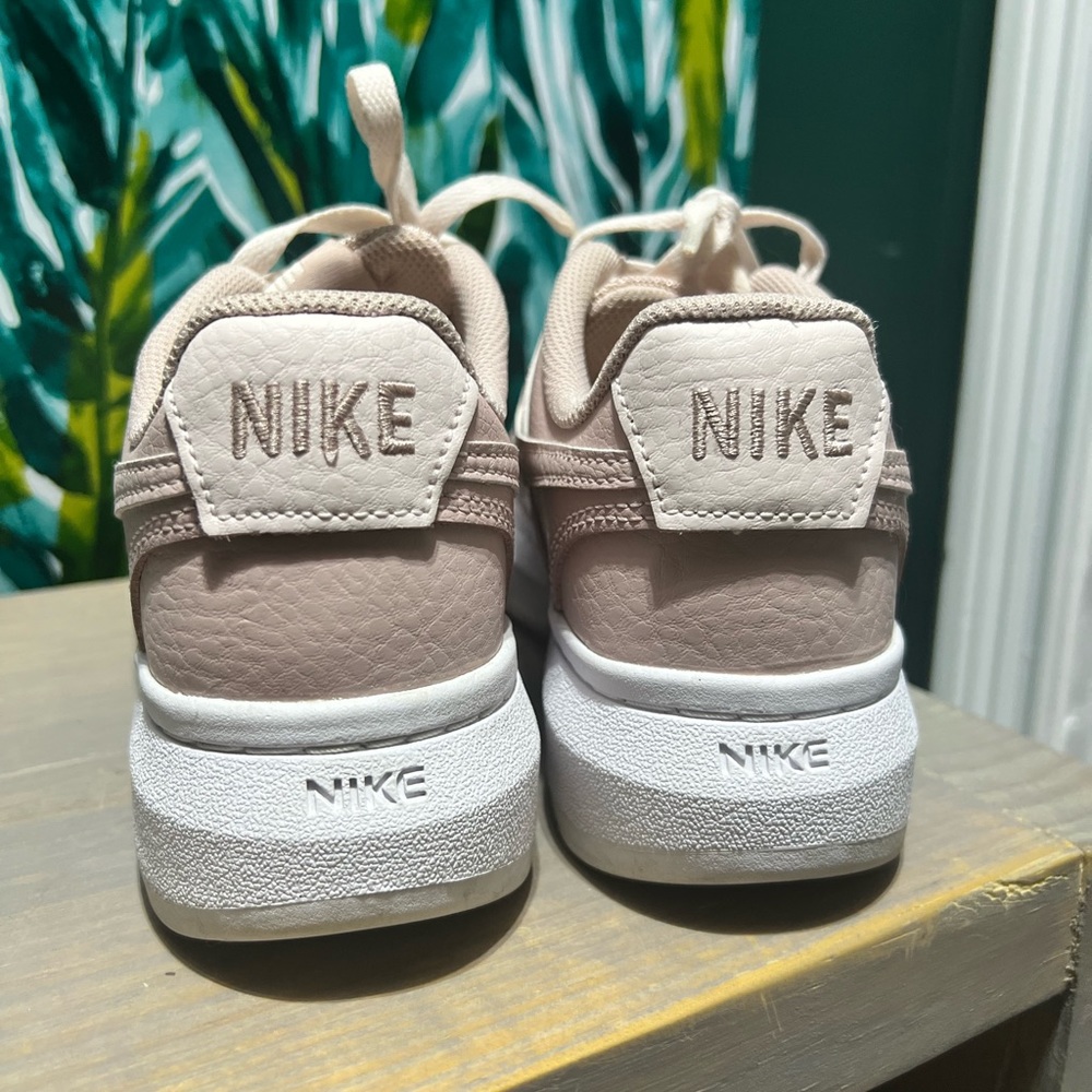 Size 7.5 light pink and white Nike’s